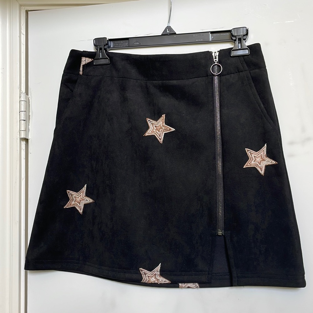 Black suede skirt with embroidered neutral stars